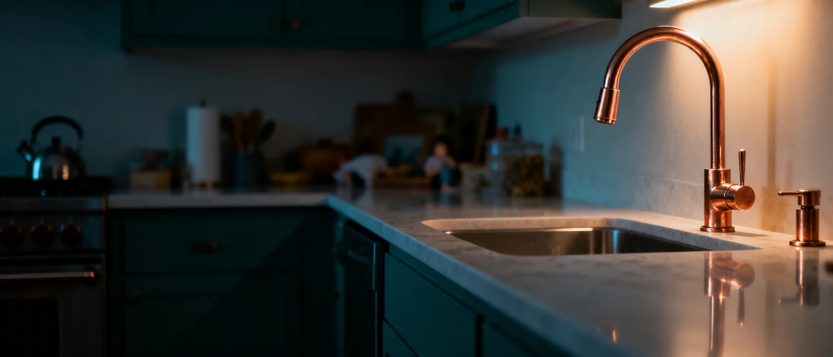 Warm finished residential kitchen with a copper-toned faucet